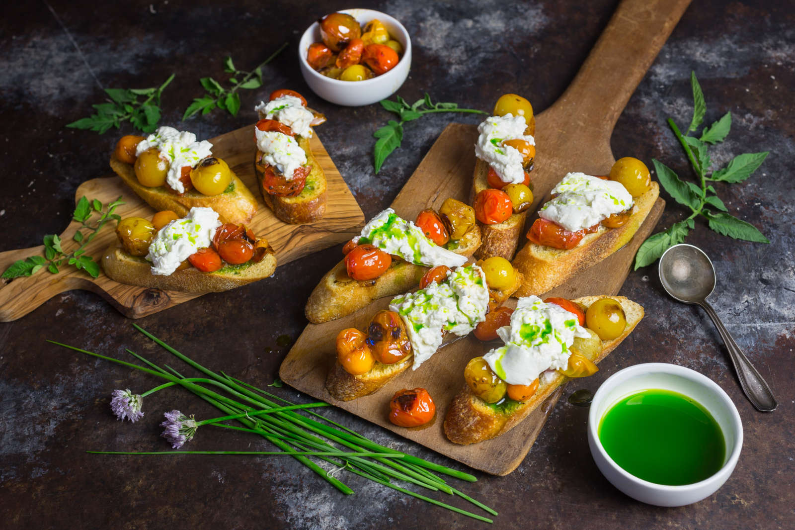 Crostini with Blistered Cherry Tomatoes, Burrata and Chive Oil
