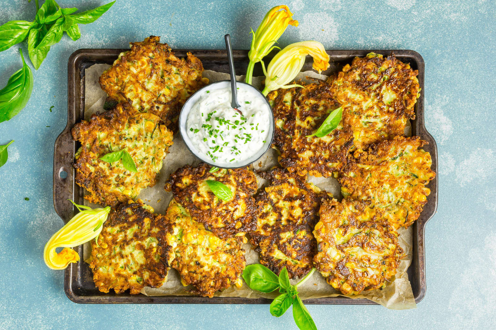 Cheesy Zucchini and Corn Fritters with Herb Sour Cream
