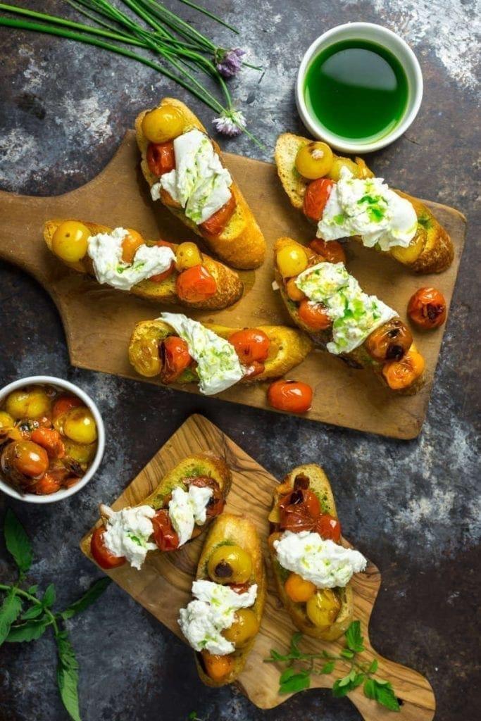Crostini with Blistered Cherry Tomatoes, Burrata and Chive Oil